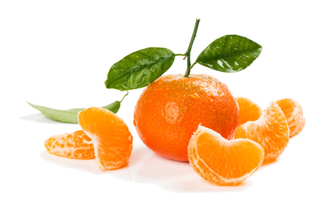Tangerine or  clementine fruit with green leaves and slices isolated white background.の写真素材