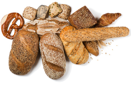 Top view of variety bread and pastry decorated with natural cereals isolated on white background.の写真素材