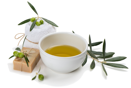 Setting with green olives and olive oil isolated on white background. Hands Spa. Manicure concept.の写真素材