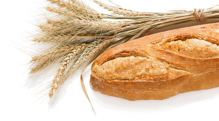 Loaf of baguettes bread and sheaf of wheat isolated on white background.の写真素材