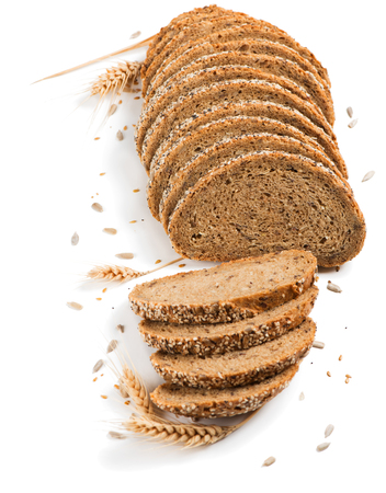 Slices of multigrain organic bread decorated with natural cereals isolated on white background.の写真素材