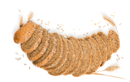Top view of slices of multigrain organic bread decorated with natural cereals isolated on white background.の写真素材