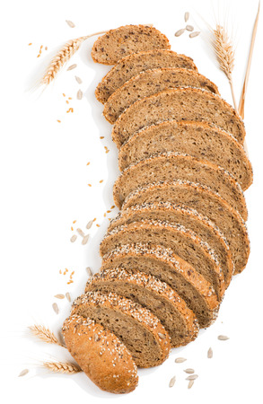 Slices wholegrain bread and cereals of poppy, flax, sunflower, sesame  isolated on white background.の写真素材