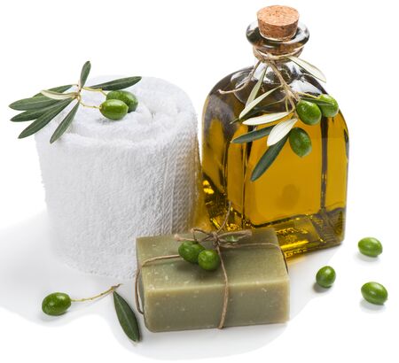 Olive oil soap and bath towel decorated with green olive fruits isolated on white background.  Spa concept.の写真素材