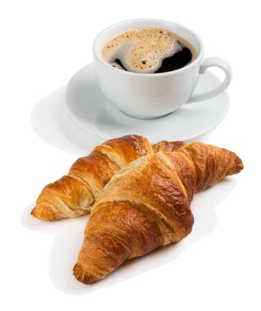 Close up of two croissants and cup of coffee isolated on white background.の写真素材