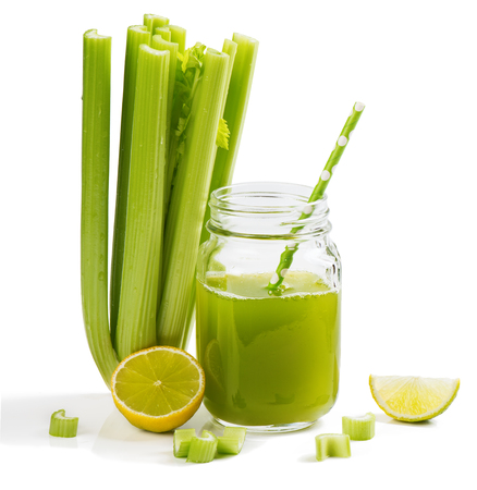 Jar mug of celery juice and lime isolated on white background.の写真素材