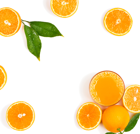 Top view of squeezed orange juice and fresh oranges fruits with green wet leaves isolated on white background.の写真素材