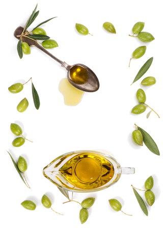 Top view of frame of green olive fruit and olive oil isolated on white background.の写真素材