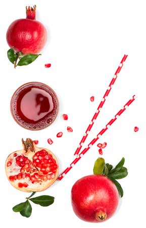 A glass of pomegranate juice with fresh pomegranate fruits isolated on white background, above view.の写真素材