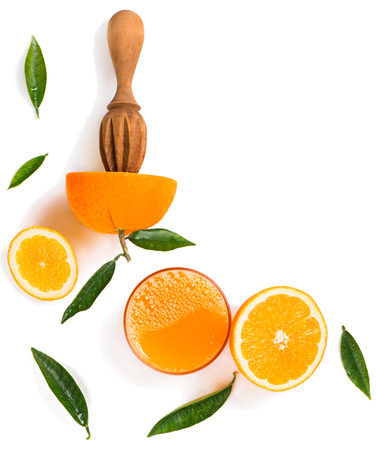 Top view of orange slices, wooden juicer stick and glass of juice of orange isolated on white background.の写真素材