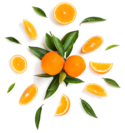 Composition of orange fruits and green leaves isolated on white background, top view.の写真素材