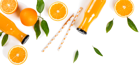  Top view of fresh orange juice made from organic orange rich in vitamins C served in bottles isolated on white background. Health or detox diet food concept.の写真素材