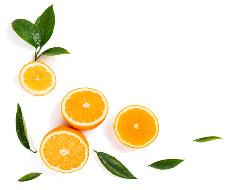  Frame from citrus slices( orange fruit) and green leaves of orange tree isolated on white background, top view.の写真素材