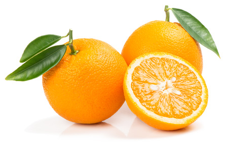 Two whole orange fruits and half with green leaves isolated on white background.の写真素材