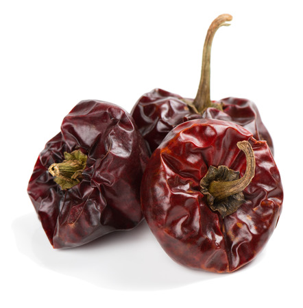   Ãora peppers are a small, round, intense and sweet-fleshed red pepper, basis of the paprika produced in Spain. Isolated on white background.の写真素材
