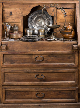 Old kitchen utensils on a rustic wooden sideboard.の写真素材