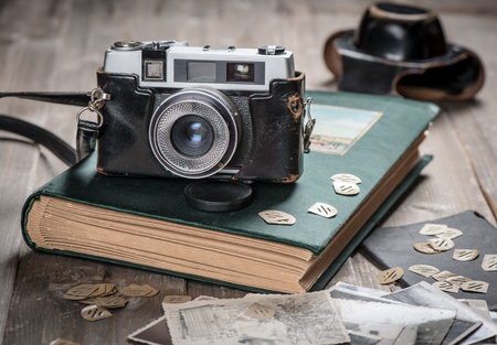 Petro foto album, old photos and camera on wooden table.の写真素材