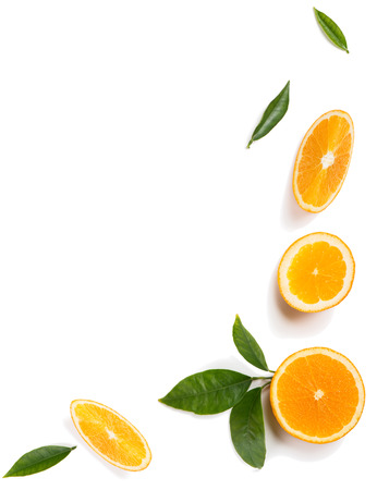 Top view of slices of citrus fruits - oranges with leaves isolated on white background.の写真素材