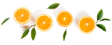 Halves of orange fruits and leaves with drops of water isolated on white background. Flat lay, top view.の写真素材