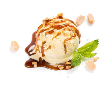   Vanilla ice cream scoop and peanut topping caramel sauce decorated with mint isolated on white background. 
の写真素材