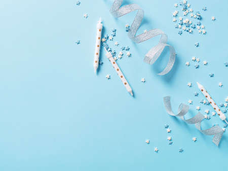 Birthday and party concept background with decoration on blue, top view, copy space,の写真素材