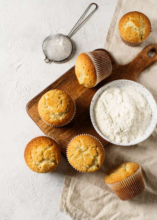 Homemade tasty miffins on white background, copy space, top view, verticalの写真素材