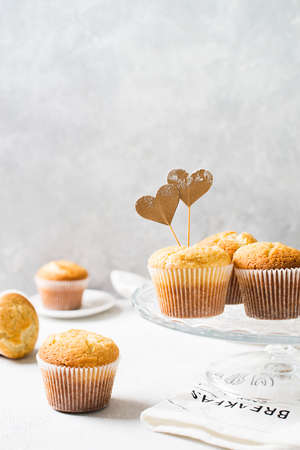 Homemade tasty miffins on white background, copy space, top view, verticalの写真素材
