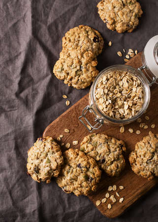 Homemade oat cookies on dark gray or brown background, healthy snack, copy space, squareの写真素材