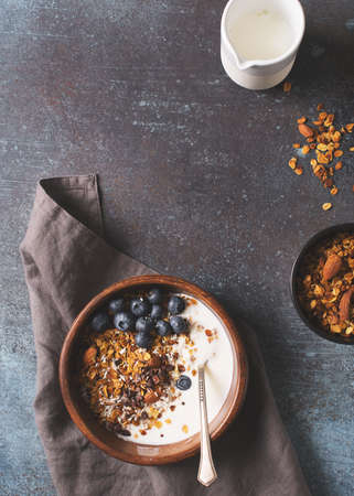 Homemade granola muesli with blueberries ondark grey background breakfastの写真素材