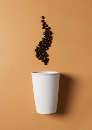 Mug or cup of coffe to go porcelain on brown background, creative pastel, zero waste concept, top view, copy space, flat layの写真素材