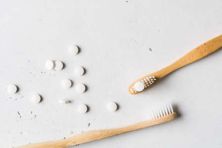 Zero waste, sustainability and minimalism concept. Wooden ecological bathroom accessories on white...