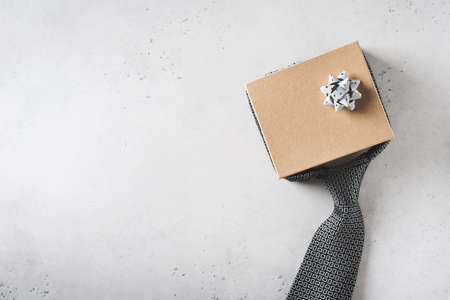 Fathers day concept with gift box and tie on white background, top view, copy spaceの写真素材