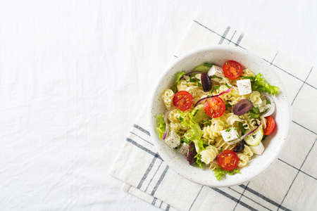 Pasta salad in a plate on white backgroundの写真素材