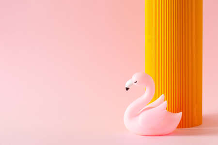 Cosmetic, summer and fashion template pink background with orange part and flamingo, minimalismの写真素材