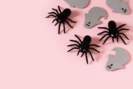 Halloween card with black spiders and grey ghost on pink backgroundの写真素材
