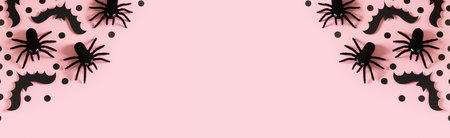 Halloween card with black spiders and confetti on pink backgroundの写真素材