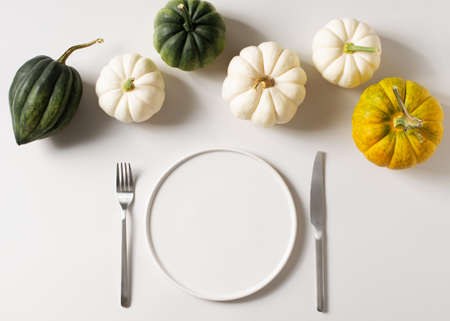 Thanksgiving, harvest and halloween setting table on whiteの写真素材
