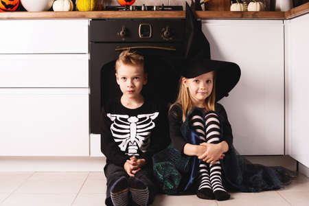 Halloween lifestyle party with caucasian kids at homeの写真素材