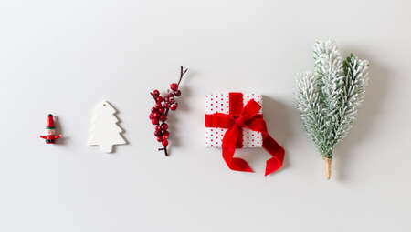 Merry christmas and happy new year background with red holidays item, gift, branch, toy in row on...