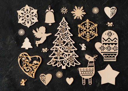 Set christmas wooden toys knolling on black background, flat lay, top view, copy spaceの写真素材