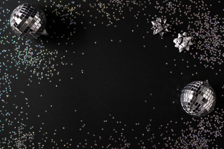 Christmas stars background with disko ball, silver and black glow and shine backdrop, celebration concept, verticalの写真素材