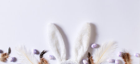 Happy easter concept with white bunny ears on grey backgroundの写真素材