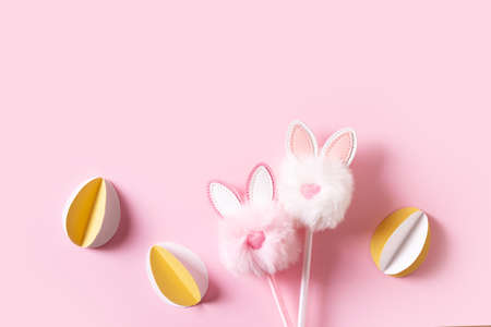 Fluffy easter decoration rabbit, easter creative concept on pink backgroundの写真素材