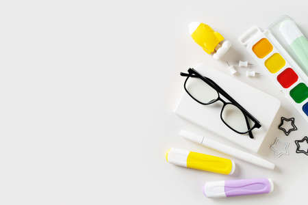 Back to school theme with white schools tools on white background