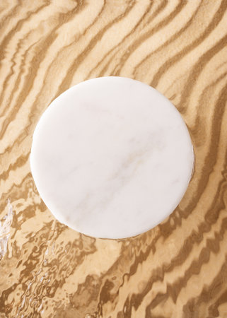 Transparent and clean water wave and sand background with podium sunlight reflection, top view, beauty backdrop, mock up, verticalの写真素材