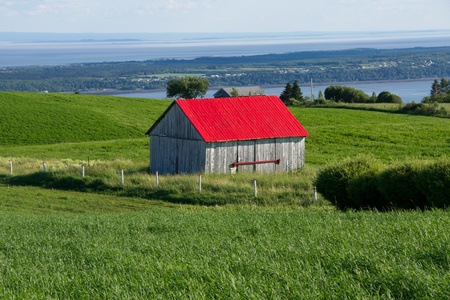 Small barn with red roof in Charlevoix Quebec, Canadaの写真素材