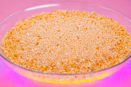 Heaping Bowl of Sesame Seeds on Colorful Surface. Generative AI.