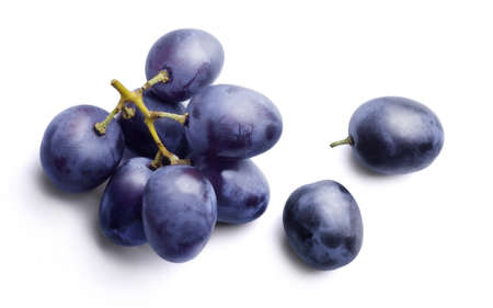 Bunch of ripe dark blue grapes Isolated on white background top view.の写真素材