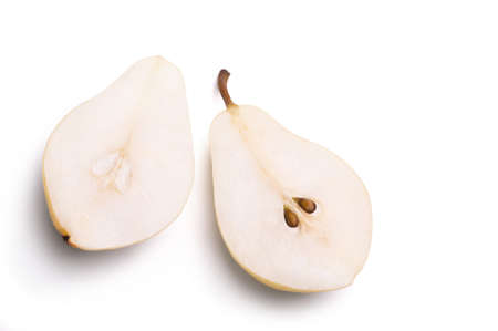 Ripe pear cut in half isolated on white background. View from above.の写真素材