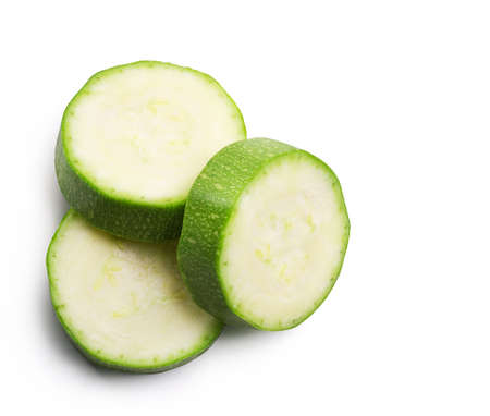 Ripe zucchini slices isolated on white background. Fresh vegetables.の写真素材